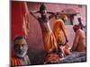 Hindu Holy Men Relax after Taking Holy Dip in River Ganges During the Kumbh Mela Festival in India-null-Mounted Photographic Print