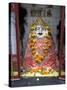 Hindu Street Shrine, Decorated with Marigold Mala (Garlands) for Diwali Festival, Udaipur, India-Annie Owen-Stretched Canvas