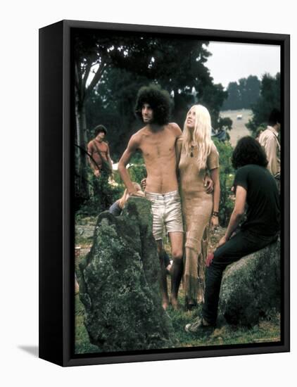 Hippie Couple Posed Together Arm in Arm with Others Around Them, During Woodstock Music/Art Fair-John Dominis-Framed Stretched Canvas