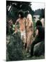 Hippie Couple Posed Together Arm in Arm with Others Around Them, During Woodstock Music/Art Fair-John Dominis-Mounted Photographic Print