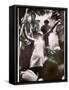 Hippie Girl Enthusiastically Playing Flute and Dancing at Woodstock Music Festival-null-Framed Stretched Canvas