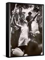 Hippie Girl Enthusiastically Playing Flute and Dancing at Woodstock Music Festival-null-Framed Stretched Canvas