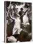 Hippie Girl Enthusiastically Playing Flute and Dancing at Woodstock Music Festival-null-Stretched Canvas