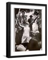 Hippie Girl Enthusiastically Playing Flute and Dancing at Woodstock Music Festival-null-Framed Photographic Print