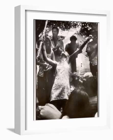 Hippie Girl Enthusiastically Playing Flute and Dancing at Woodstock Music Festival-null-Framed Photographic Print