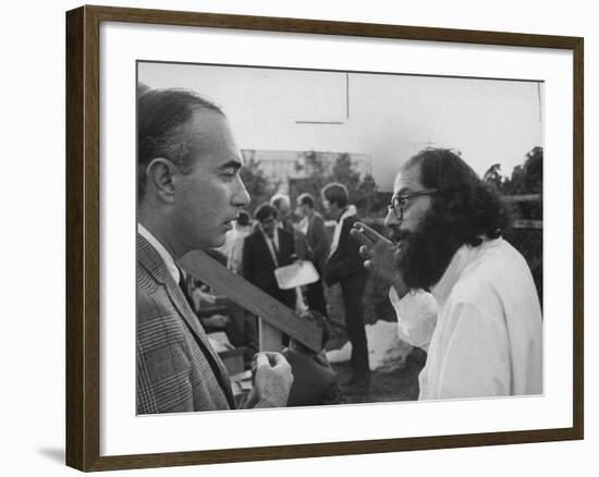 Hippie Poet Allen Ginsberg Speaking to Conservative-Looking Man During Vietnam War Protest Rally-null-Framed Premium Photographic Print