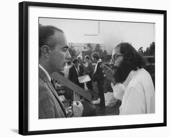 Hippie Poet Allen Ginsberg Speaking to Conservative-Looking Man During Vietnam War Protest Rally-null-Framed Premium Photographic Print