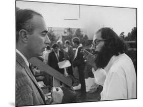 Hippie Poet Allen Ginsberg Speaking to Conservative-Looking Man During Vietnam War Protest Rally-null-Mounted Premium Photographic Print