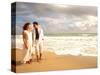 Hispanic Couple Walking Together on the Beach-Bill Bachmann-Stretched Canvas