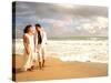 Hispanic Couple Walking Together on the Beach-Bill Bachmann-Stretched Canvas