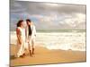 Hispanic Couple Walking Together on the Beach-Bill Bachmann-Mounted Photographic Print