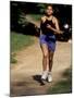 Hispanic Woman Running for Exercise, New York, New York, USA-Paul Sutton-Mounted Photographic Print