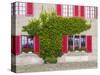 Historical facade with red shutters and green ivy-enricocacciafotografie-Stretched Canvas