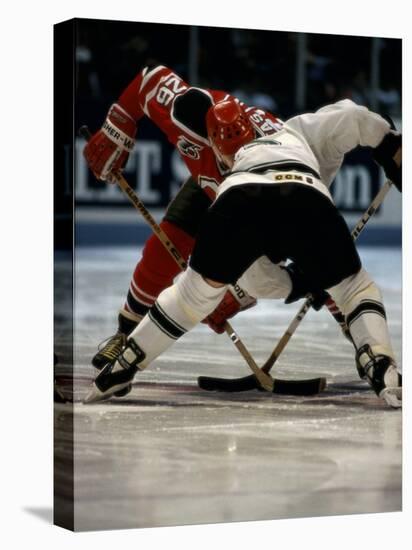 Hockey Players in Head to Head Competition-null-Stretched Canvas