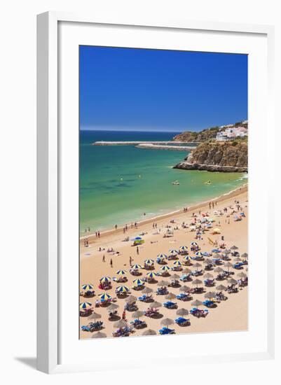 Holidaymakers Sunbathing under Beach Umbrellas-Neale Clark-Framed Photographic Print