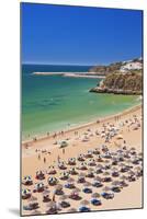 Holidaymakers Sunbathing under Beach Umbrellas-Neale Clark-Mounted Photographic Print