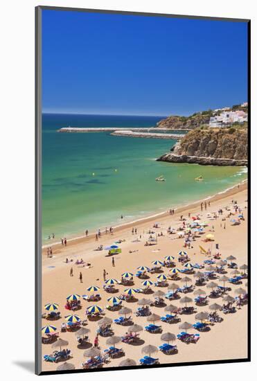 Holidaymakers Sunbathing under Beach Umbrellas-Neale Clark-Mounted Photographic Print