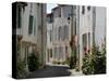 Hollyhocks Lining a Street, La Flotte, Ile De Re, Charente-Maritime, France, Europe-Richardson Peter-Stretched Canvas