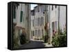 Hollyhocks Lining a Street, La Flotte, Ile De Re, Charente-Maritime, France, Europe-Richardson Peter-Framed Stretched Canvas