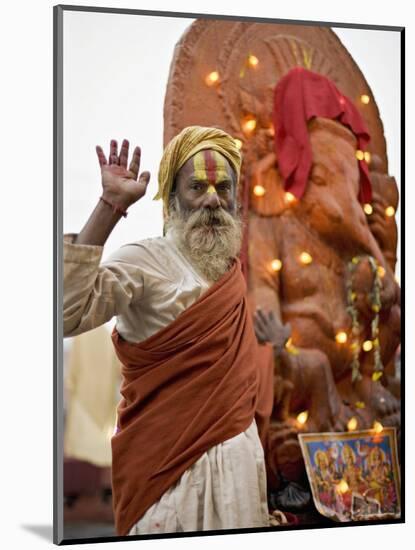 Holy Man in Front of a Ganesh Statue Draped in Fairy Lights at the Hindu Festival of Shivaratri-Don Smith-Mounted Photographic Print