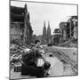 Homeless Refugee German Woman Sitting with All Her Worldly Possessions on Side of a Muddy Street-John Florea-Mounted Photographic Print