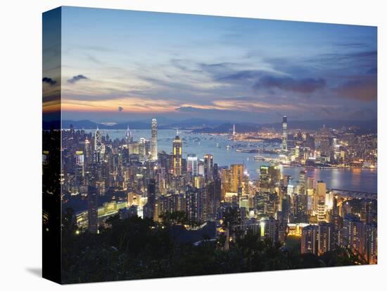 Hong Kong Island and Kowloon Skylines at Sunset, Hong Kong, China-Ian Trower-Stretched Canvas