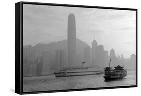 Hong Kong Skyline with Boats in Victoria Harbor in Black and White.-Songquan Deng-Framed Stretched Canvas