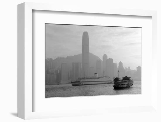 Hong Kong Skyline with Boats in Victoria Harbor in Black and White.-Songquan Deng-Framed Photographic Print