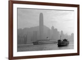 Hong Kong Skyline with Boats in Victoria Harbor in Black and White.-Songquan Deng-Framed Photographic Print