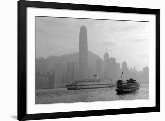 Hong Kong Skyline with Boats in Victoria Harbor in Black and White.-Songquan Deng-Framed Photographic Print