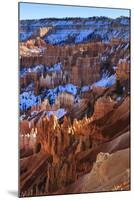 Hoodoos and Snowy Rim Cliffs Lit by Strong Late Afternoon Sun in Winter-Eleanor-Mounted Photographic Print