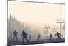 Horizontal Vector Illustration Skiers in Hills of Coniferous Forest at Snowfall Sunset.-Vertyr-Mounted Art Print