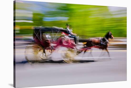 Horse and carriage drives in traffic down Central Park West in Manhattan, New York City, NY-null-Stretched Canvas