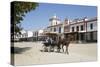 Horse and carriage riding along sand streets with brotherhood houses behind, El Rocio, Huelva Provi-Stuart Black-Stretched Canvas