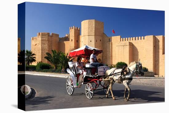 Horse drawn carriage ride in front of the Ribat in Monastir, Tunisia-null-Stretched Canvas