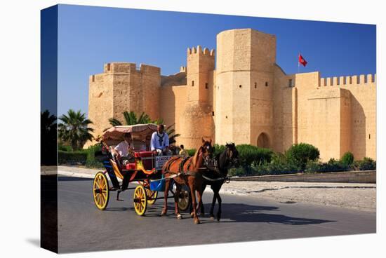 Horse drawn carriage ride in front of the Ribat in Monastir, Tunisia-null-Stretched Canvas