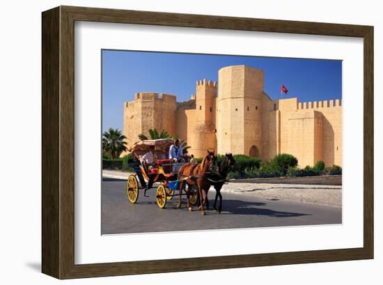 Horse drawn carriage ride in front of the Ribat in Monastir, Tunisia-null-Framed Art Print