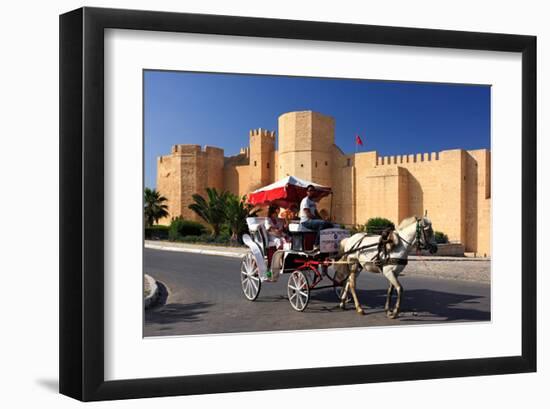 Horse drawn carriage ride in front of the Ribat in Monastir, Tunisia-null-Framed Art Print