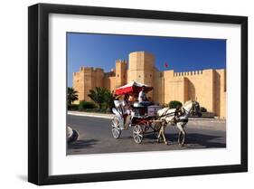 Horse drawn carriage ride in front of the Ribat in Monastir, Tunisia-null-Framed Art Print