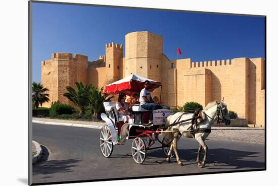 Horse drawn carriage ride in front of the Ribat in Monastir, Tunisia-null-Mounted Art Print