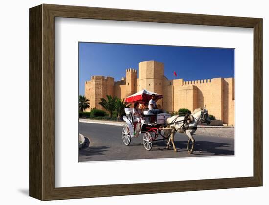 Horse drawn carriage ride in front of the Ribat in Monastir, Tunisia-null-Framed Art Print