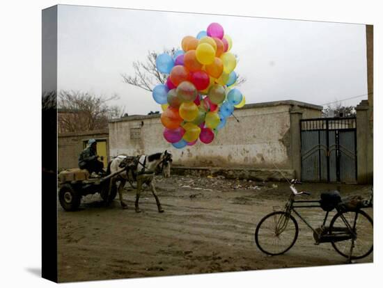 Horse Drawn Cart Drives Past as Balloons Tied to a Bicycle Flutter in the Wind-null-Stretched Canvas
