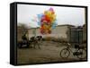 Horse Drawn Cart Drives Past as Balloons Tied to a Bicycle Flutter in the Wind-null-Framed Stretched Canvas