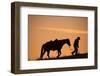 Horse drive in winter, Shell, Wyoming. Cowboy leading his horse at sunset and silhouetted.-Darrell Gulin-Framed Photographic Print