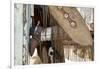 Horse drive in winter, Shell, Wyoming. Cowgirl standing in doorway of old log cabin.-Darrell Gulin-Framed Photographic Print