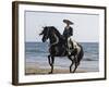 Horseman in Traditional Dress Riding Black Andalusian Stallion on Beach, Ojai, California, USA-Carol Walker-Framed Photographic Print