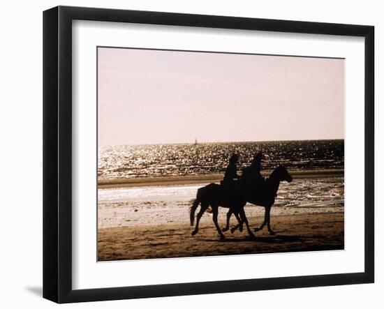 Horseriding on the Beach at Sunset, 1985 Normandy Deauville France-null-Framed Premium Photographic Print