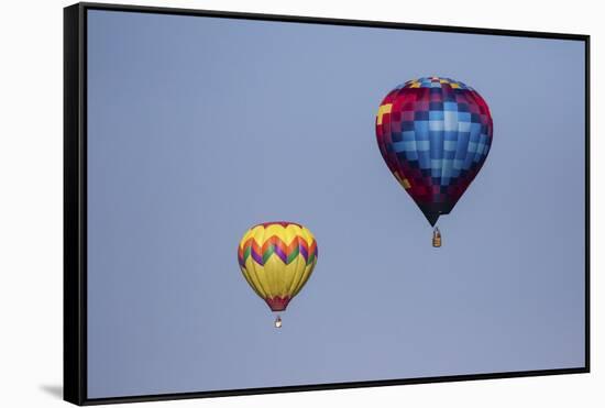 Hot air balloon bringing color to the sky.-Larry Ditto-Framed Stretched Canvas