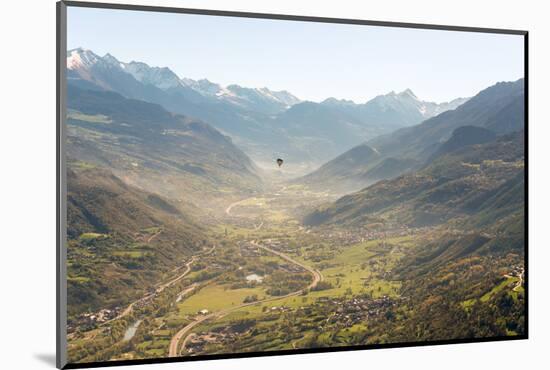 hot air balloon flies over Aosta city, Valle d'Aosta, Italy, Europe.-ClickAlps-Mounted Photographic Print