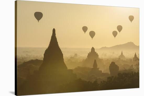 Hot air balloons above the temples of Bagan (Pagan), Myanmar (Burma), Asia-Janette Hill-Stretched Canvas